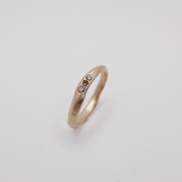 Soft wave ring with brown diamonds