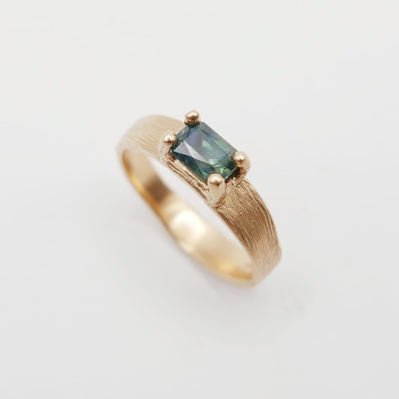 Ring with unique blue sapphire