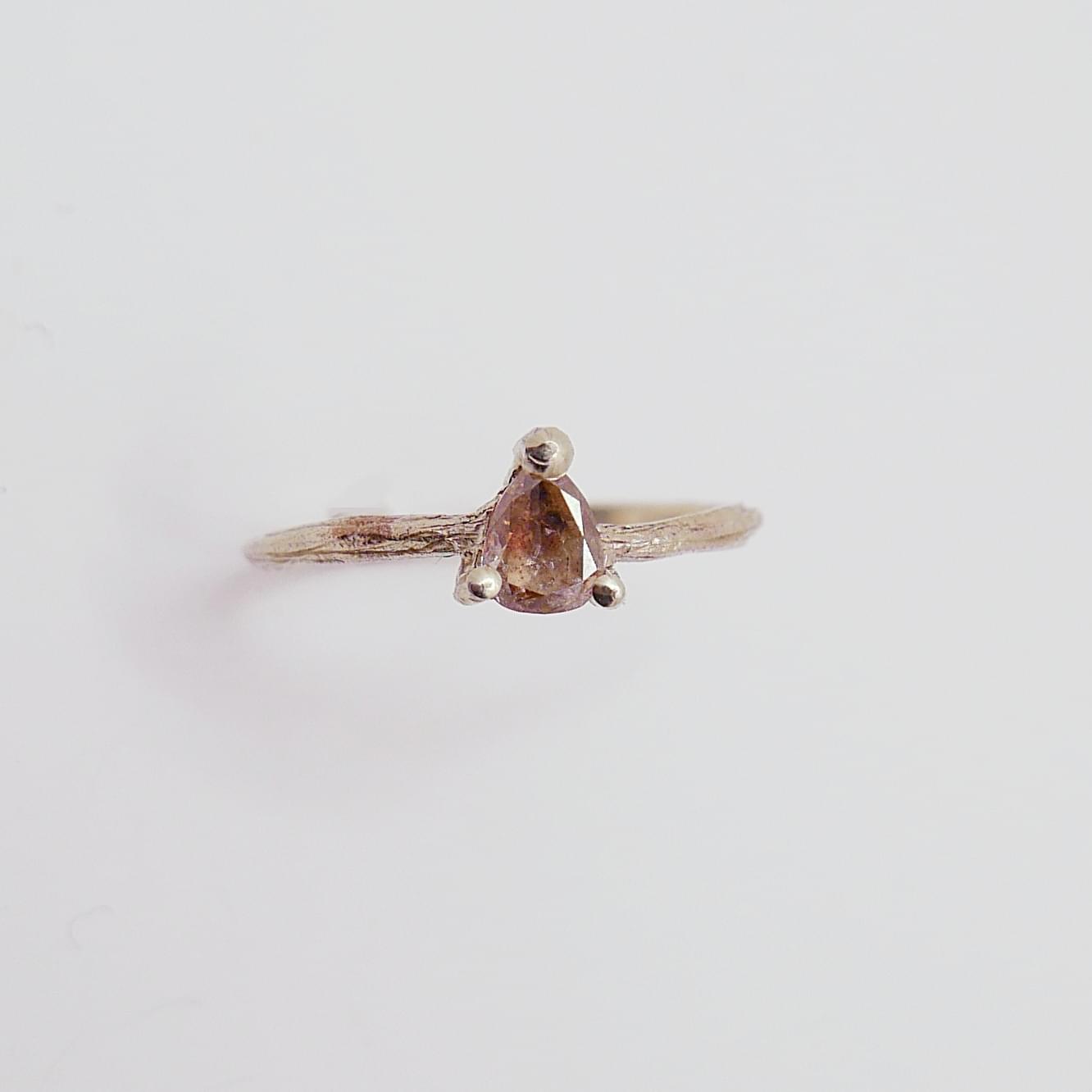 Fine ring with pear-cut brown diamond